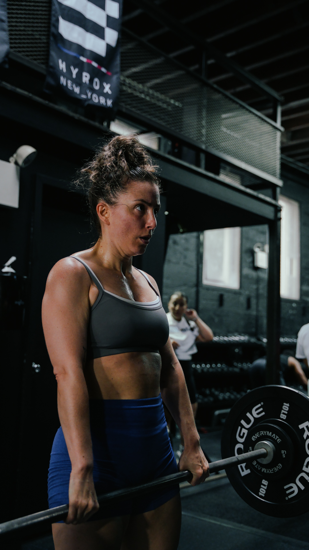 Deadlift under HYROX New York banners at BOLT Fitness