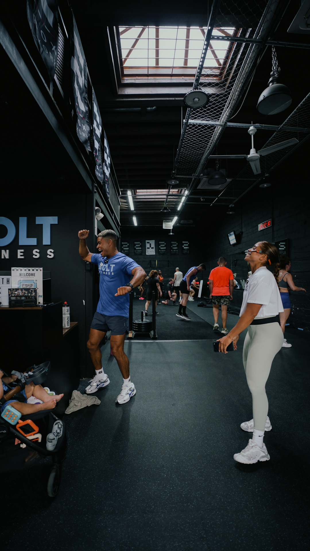 Inside BOLT Fitness with the BOLT FITNESS sign lit above the floor