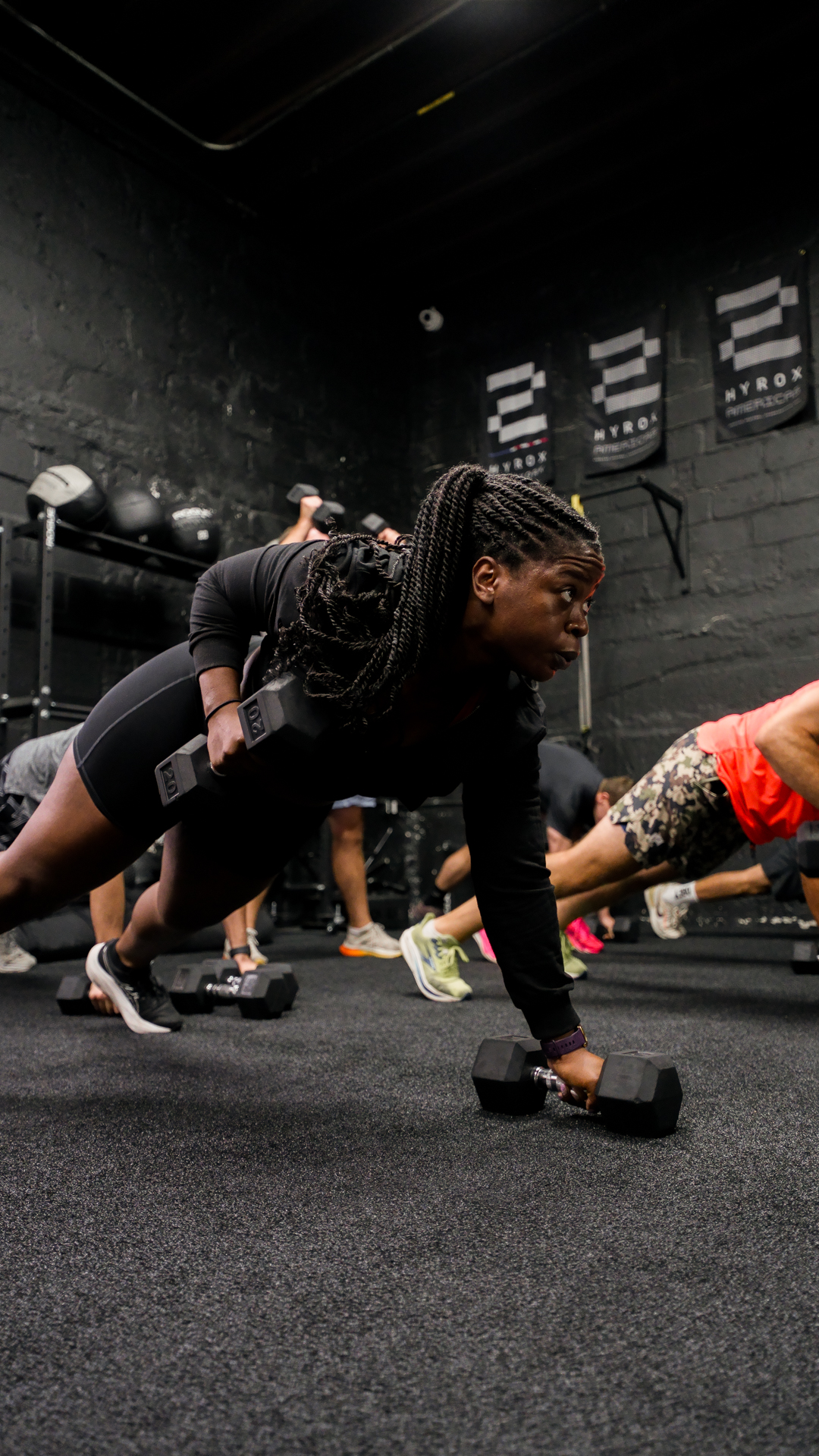 Renegade row training under HYROX Americas banners at BOLT Fitness