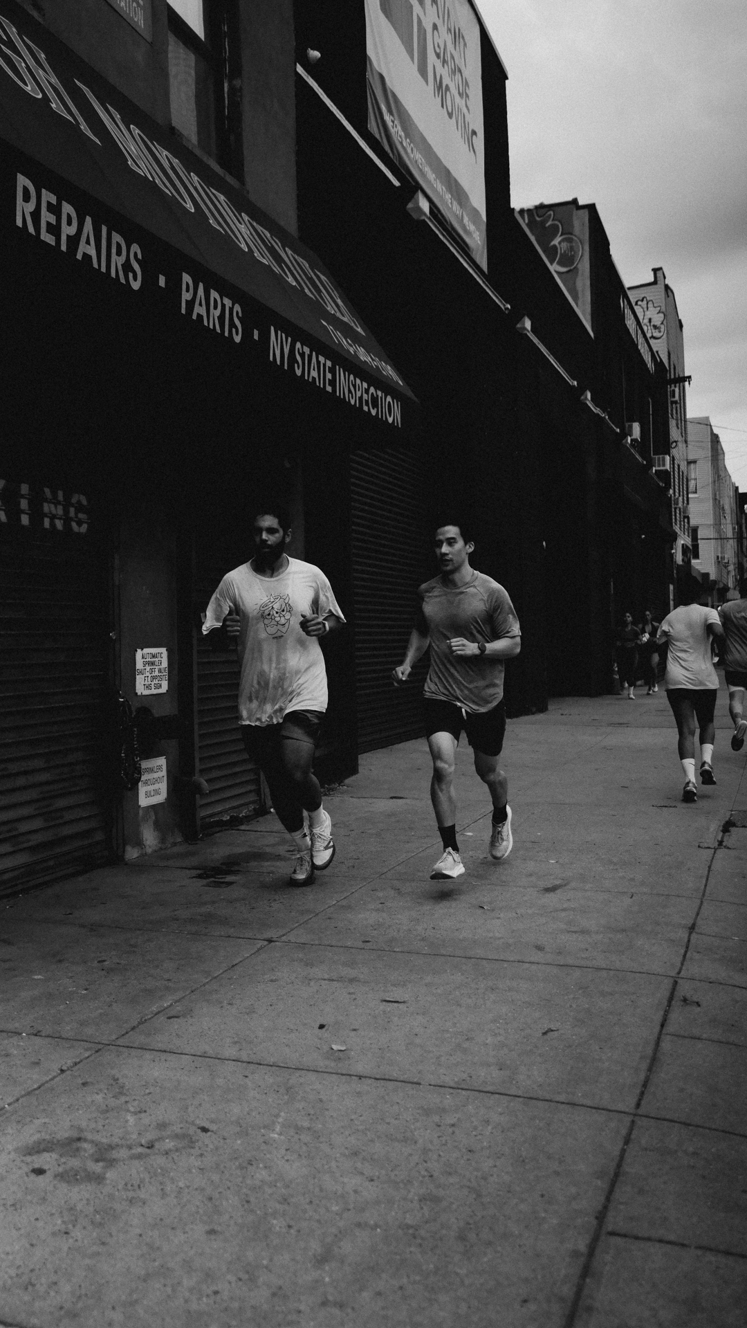 Athletes running outdoors as part of BOLT Fitness conditioning