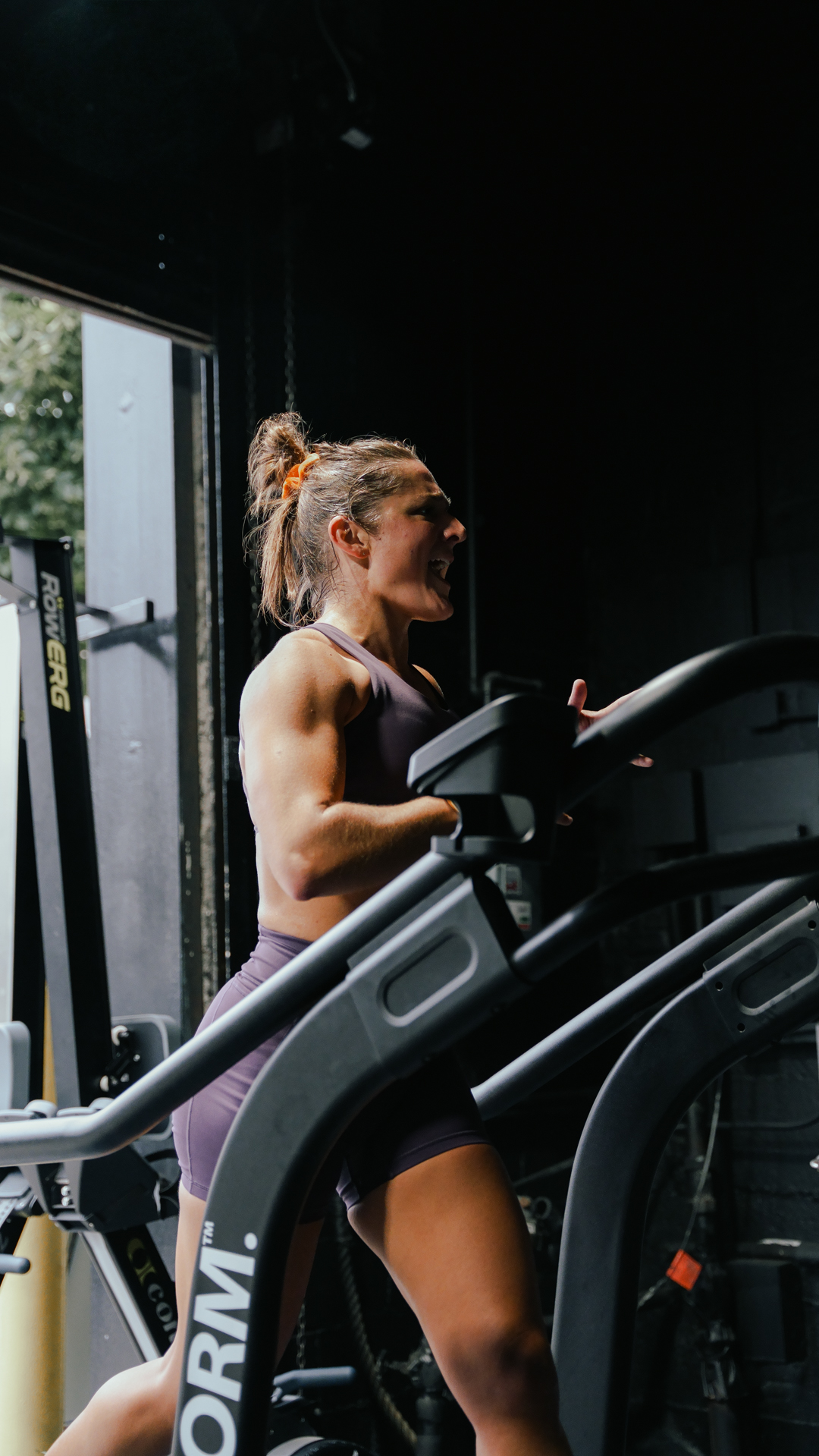 Athlete running on a FORM treadmill at BOLT Fitness